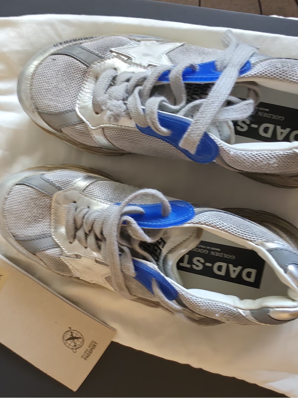 Golden Goose "Dad-Star"  woman’s Silver Sneakers with Blue Tongue Accents
